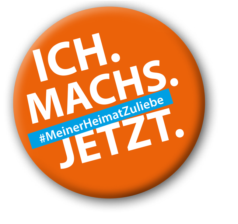Orangener Badge mit Text: "Ich machs jetzt #MeinerHeimatZuliebe"